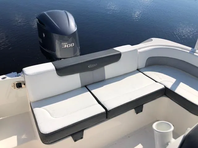 Slide: The Image of 2022 Robalo R242 Center Console boat with Yamaha 300 engine and cushioned seating. - 21