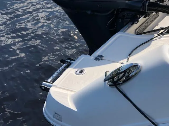 Slide: The Image of 2022 Robalo R242 Center Console boat stern with water reflection. - 28