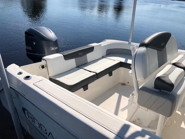 Slide: The Image of 2022 Robalo R242 Center Console boat with Yamaha 300 engine, featuring spacious seating. - 3