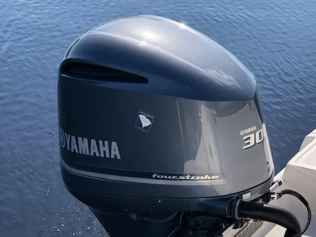 Slide: The Image of Yamaha 300 outboard motor on 2022 Robalo R242 Center Console boat. - 7