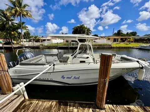 The Image of 2023 Jeanneau Leader 7.5 CC Series 3 boat docked by a sunny waterfront. - 0