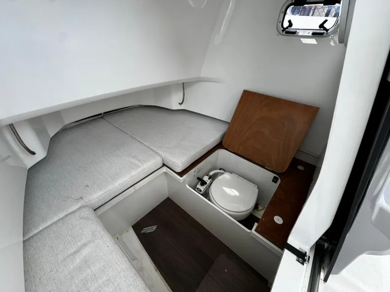 Slide: The Image of 2023 Jeanneau Leader 7.5 CC Series 3 cabin interior with compact toilet and seating. - 11