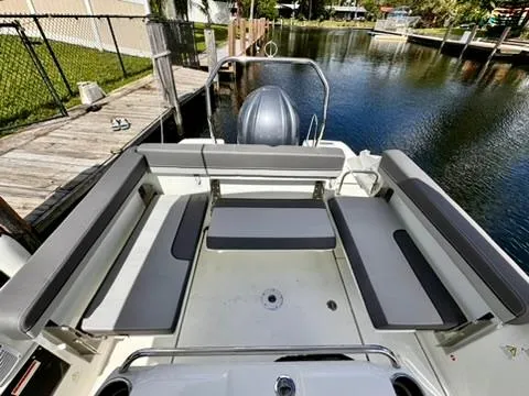 Slide: The Image of 2023 Jeanneau Leader 7.5 CC Series 3 boat with spacious seating by the water. - 15