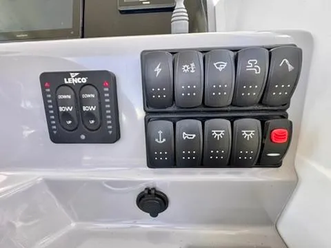 Slide: The Image of Control panel of 2023 Jeanneau Leader 7.5 CC Series 3 boat with various switches. - 17