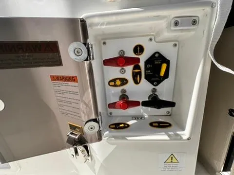 Slide: The Image of Control panel of 2023 Jeanneau Leader 7.5 CC Series 3 boat with warning labels. - 22