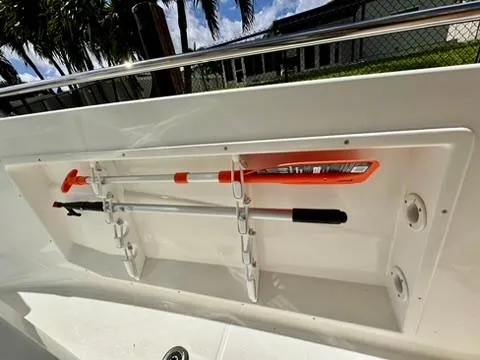 Slide: The Image of 2023 Jeanneau Leader 7.5 CC Series 3 boat storage compartment with safety equipment. - 31