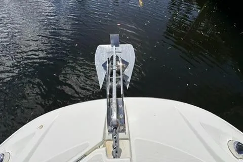 Slide: The Image of 2023 Jeanneau Leader 7.5 CC Series 3 boat anchor on calm water. - 35