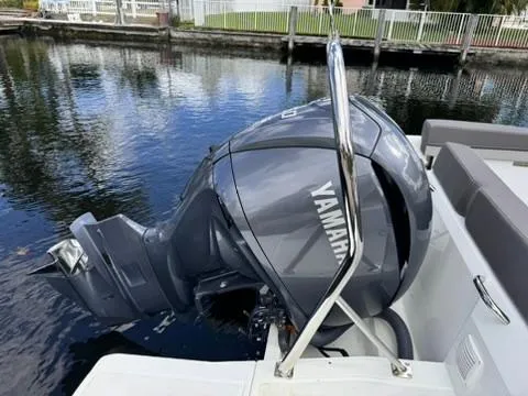 Slide: The Image of 2023 Jeanneau Leader 7.5 CC Series 3 with Yamaha outboard motor on water. - 7