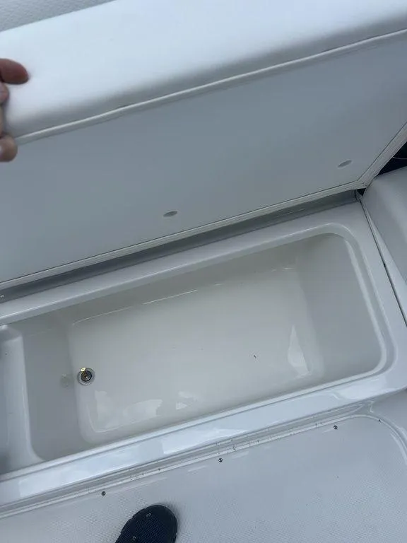 Slide: The Image of 2025 Formula 290 Bowrider storage compartment, open and empty. - 22