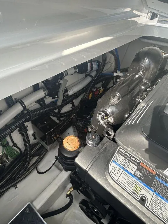 Slide: The Image of 2025 Formula 290 Bowrider engine compartment with Mercury engine components. - 27