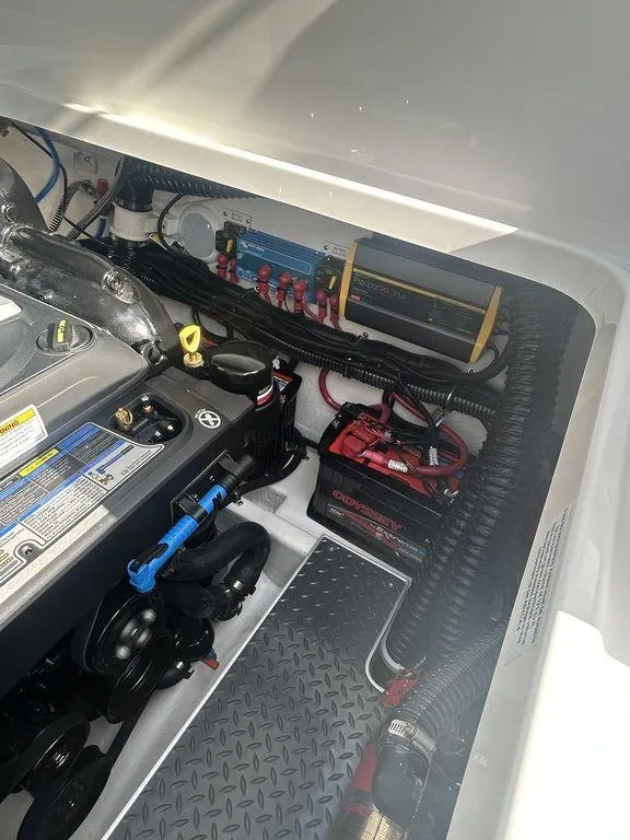 Slide: The Image of Engine compartment of 2025 Formula 290 Bowrider, showcasing battery and wiring components. - 29