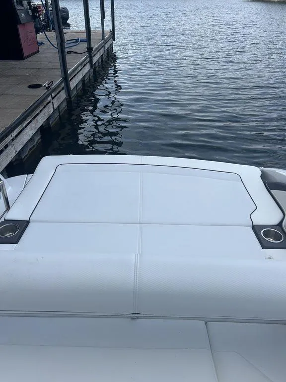 Slide: The Image of 2025 Formula 290 Bowrider docked by the water. - 7