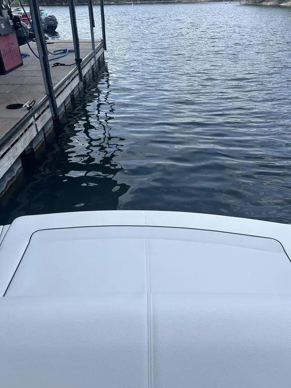 Slide: The Image of 2025 Formula 290 Bowrider at dock, calm water view. - 9