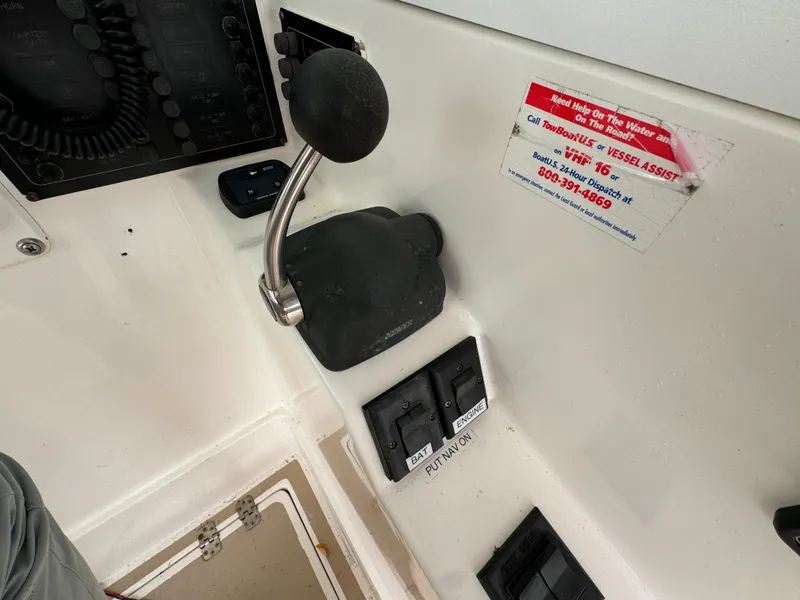 Slide: The Image of Control panel of 2003 Albin 28 TE Flush Deck boat with throttle and switches. - 16