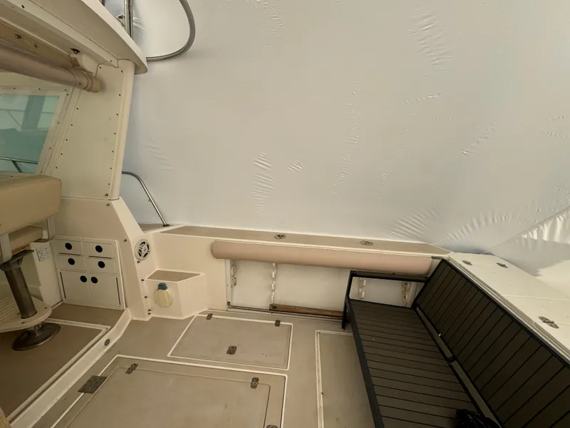 Slide: The Image of 2003 Albin 28 TE Flush Deck interior with seating and storage compartments. - 9