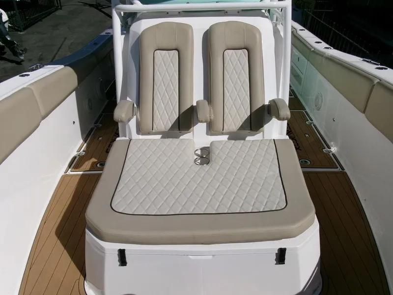 Slide: The Image of 2018 Sea Fox 328 Commander boat seating with beige upholstery and diamond stitching. - 10