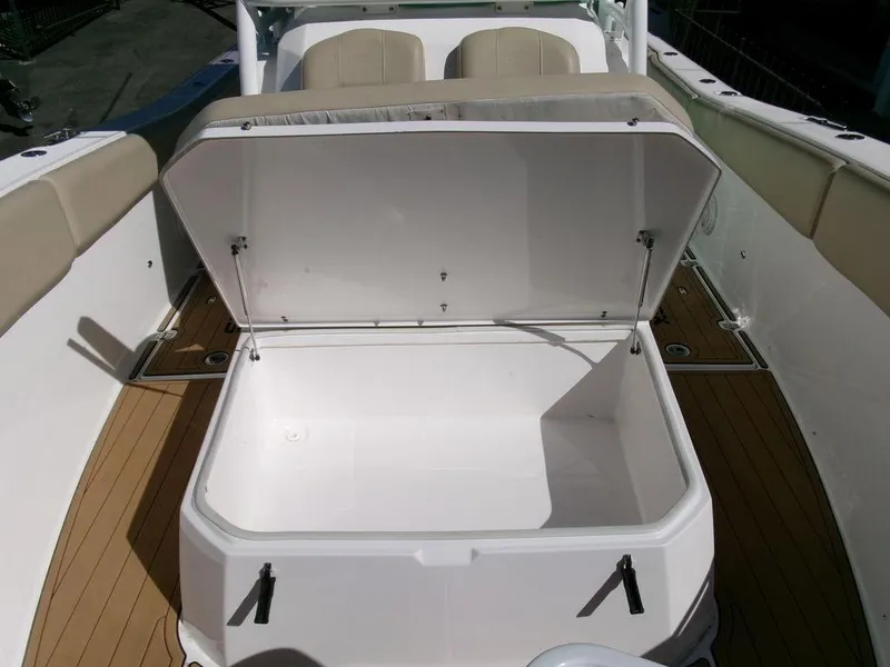 Slide: The Image of 2018 Sea Fox 328 Commander boat storage compartment open on deck. - 11