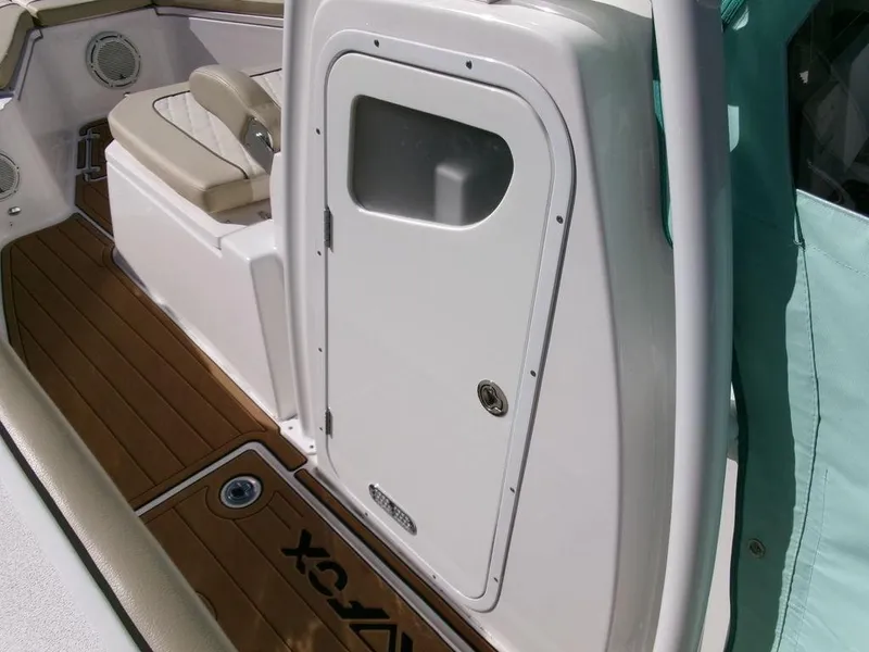 Slide: The Image of 2018 Sea Fox 328 Commander boat interior with seating and storage compartment. - 12