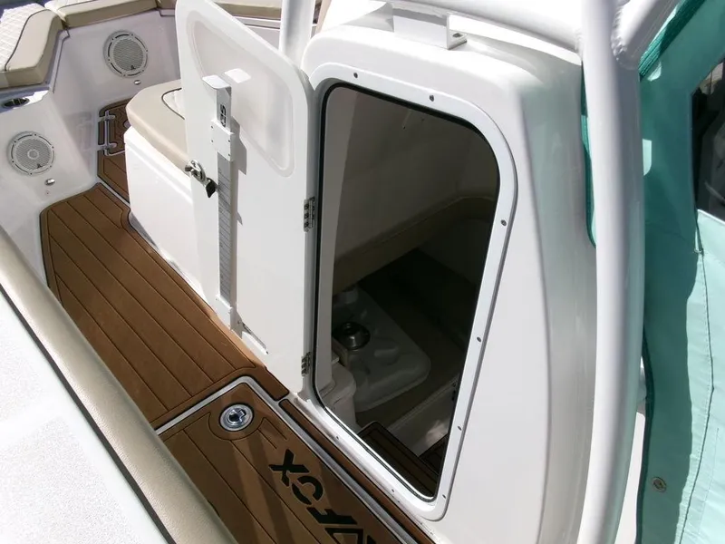 Slide: The Image of 2018 Sea Fox 328 Commander boat interior with open cabin door and teak flooring. - 13