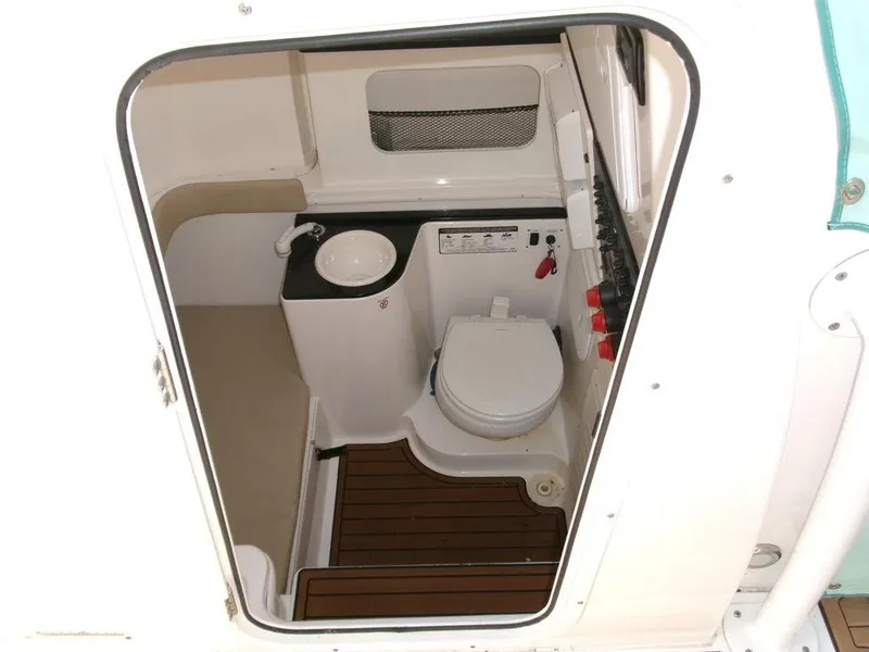 Slide: The Image of 2018 Sea Fox 328 Commander boat bathroom interior with sink and toilet. - 14