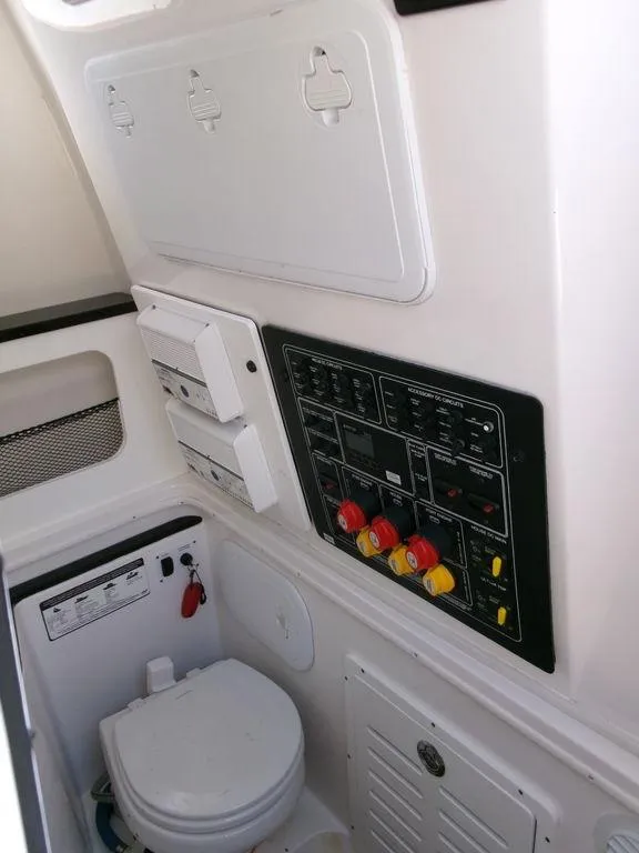 Slide: The Image of 2018 Sea Fox 328 Commander boat interior with control panel and marine toilet. - 15