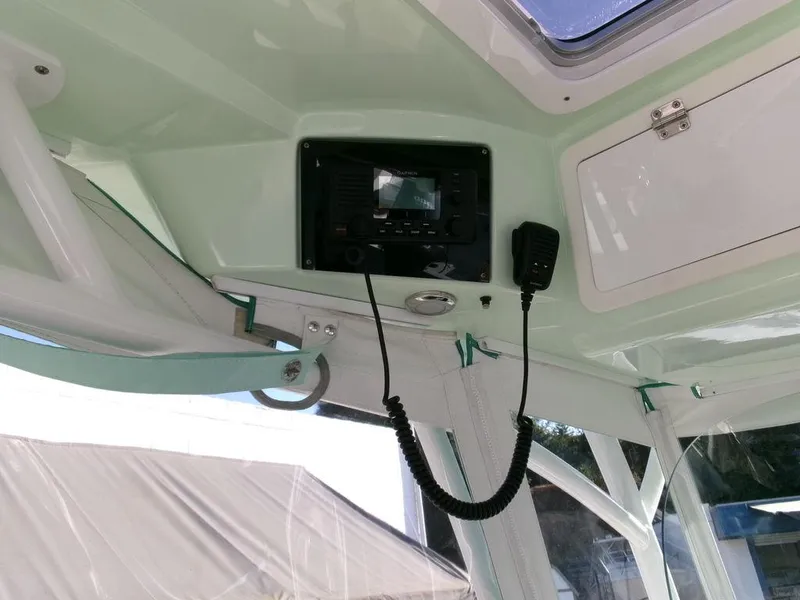 Slide: The Image of Interior view of 2018 Sea Fox 328 Commander boat with radio and microphone. - 23