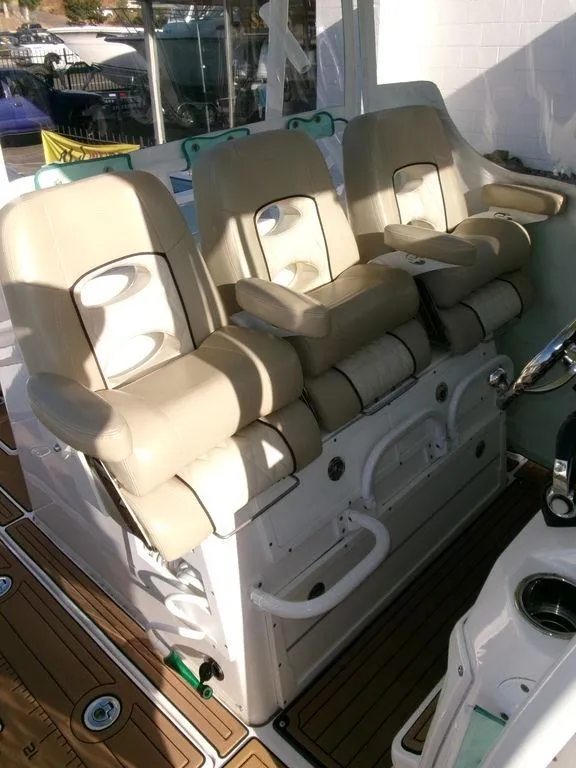 Slide: The Image of 2018 Sea Fox 328 Commander boat seats with beige upholstery and white base. - 28