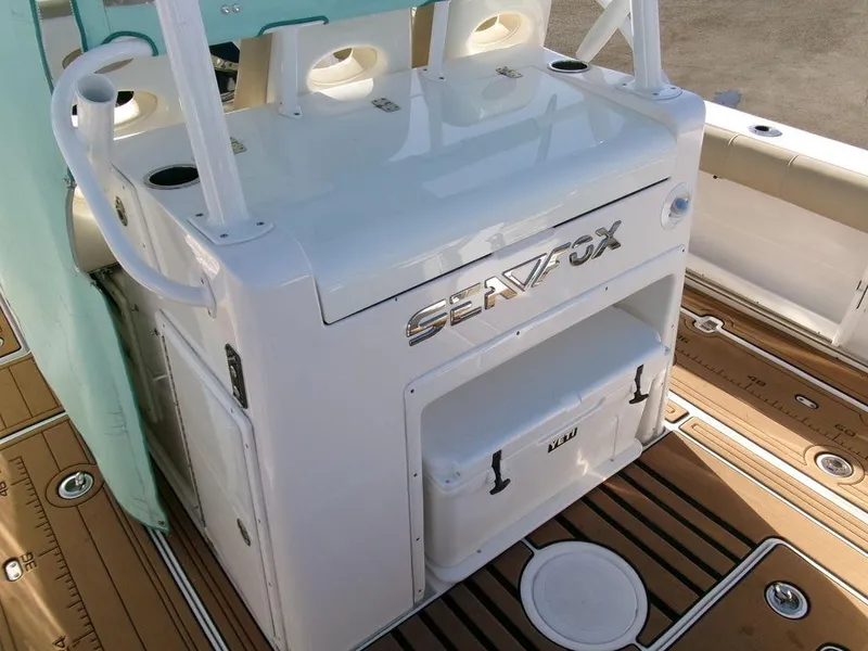 Slide: The Image of Sea Fox 328 Commander 2018 boat interior with storage and cooler on deck. - 29