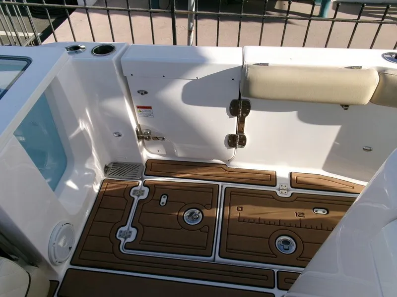 Slide: The Image of 2018 Sea Fox 328 Commander boat deck with cushioned seating and wood-patterned flooring. - 32