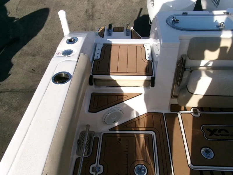 Slide: The Image of 2018 Sea Fox 328 Commander boat deck with seating and storage compartments. - 36