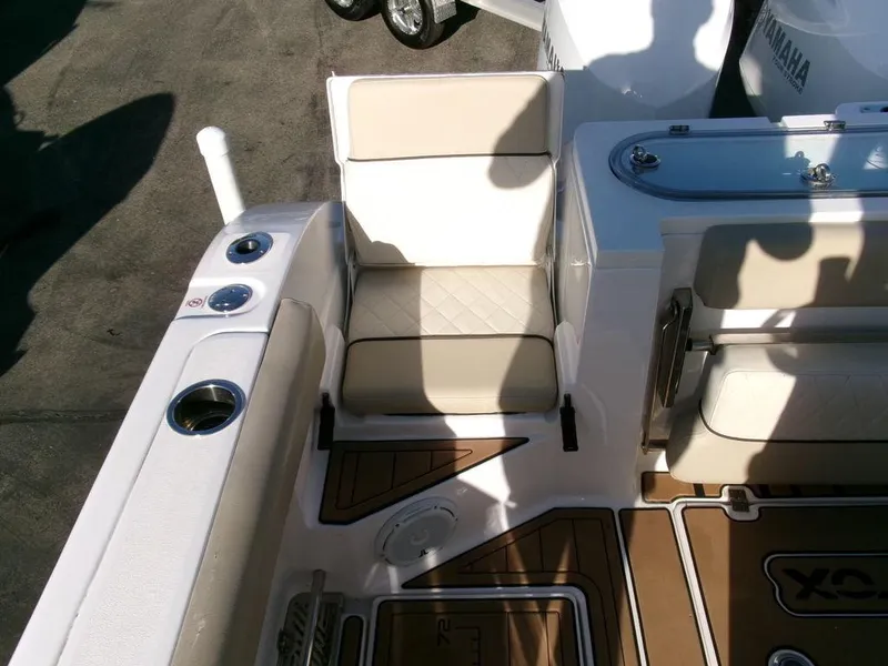 Slide: The Image of 2018 Sea Fox 328 Commander boat seating area with beige cushions and deck details. - 37