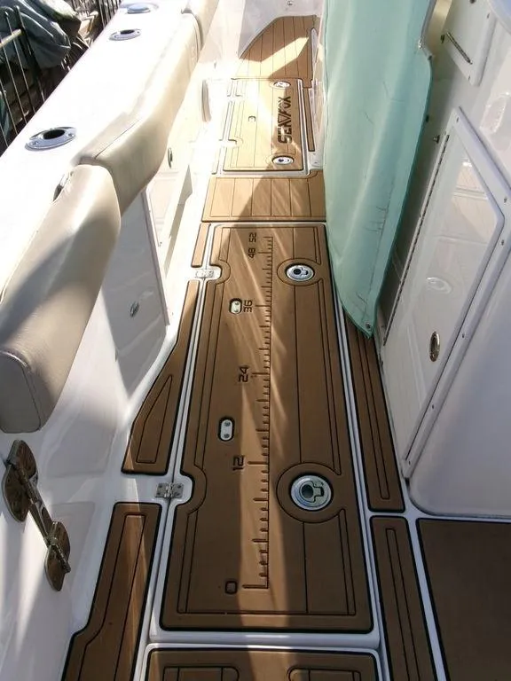 Slide: The Image of 2018 Sea Fox 328 Commander boat deck with cushioned seating and storage compartments. - 40