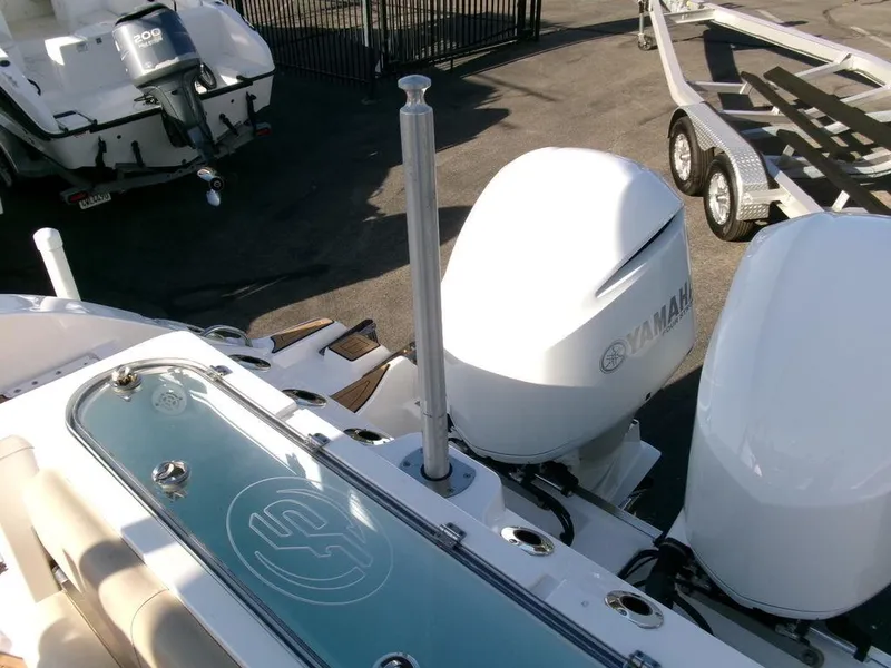 Slide: The Image of 2018 Sea Fox 328 Commander with Yamaha outboard engines and trailer in a marina setting. - 41