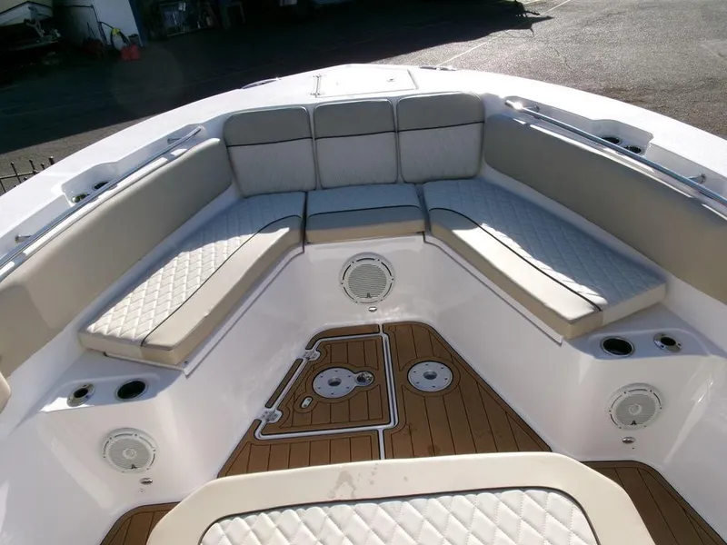 Slide: The Image of 2018 Sea Fox 328 Commander boat interior with cushioned seating and teak flooring. - 7