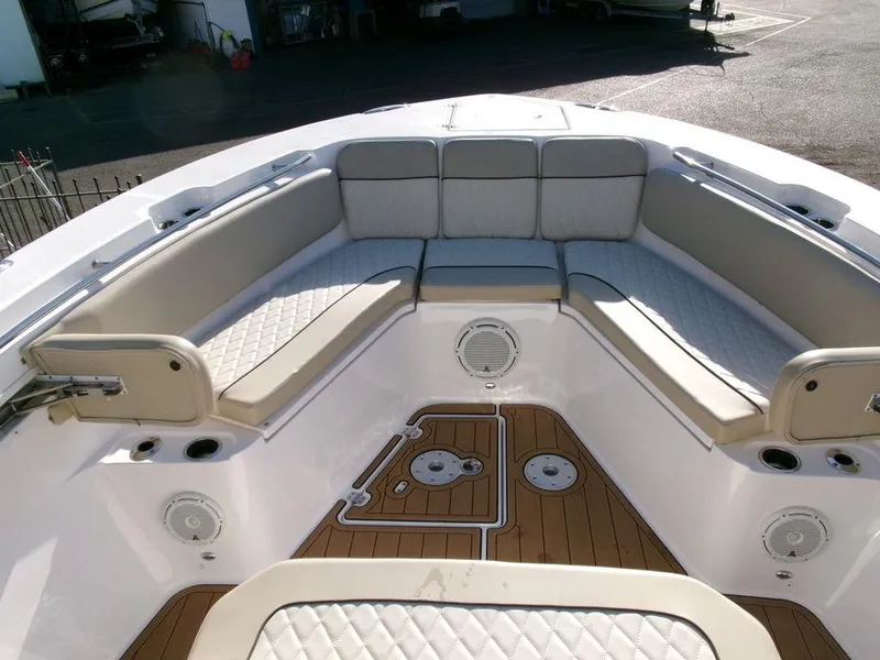 Slide: The Image of 2018 Sea Fox 328 Commander boat interior with cushioned seating and teak flooring. - 8