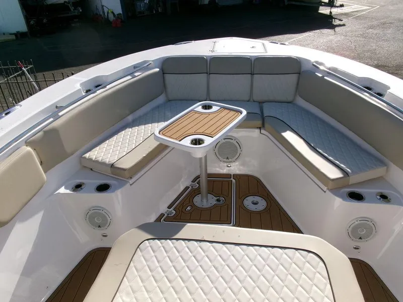 Slide: The Image of 2018 Sea Fox 328 Commander boat interior with cushioned seating and table. - 9