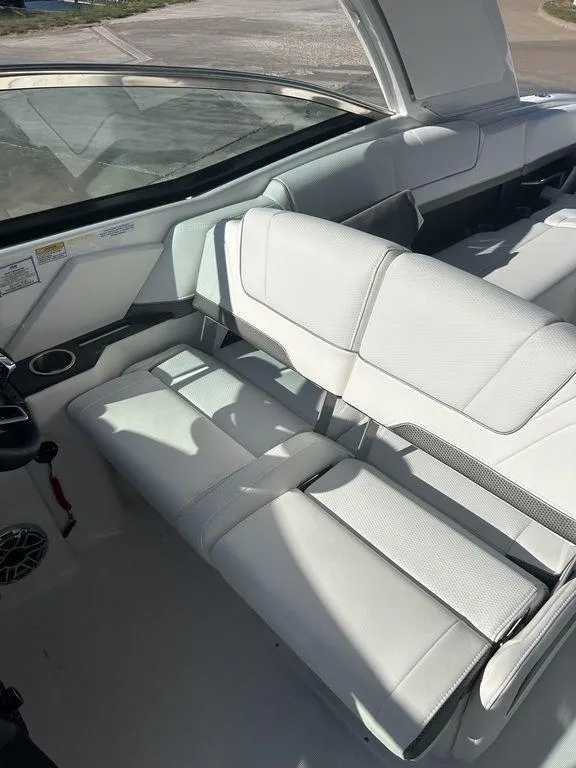Slide: The Image of 2025 Formula 310 Bowrider interior with white leather seating and modern design. - 15