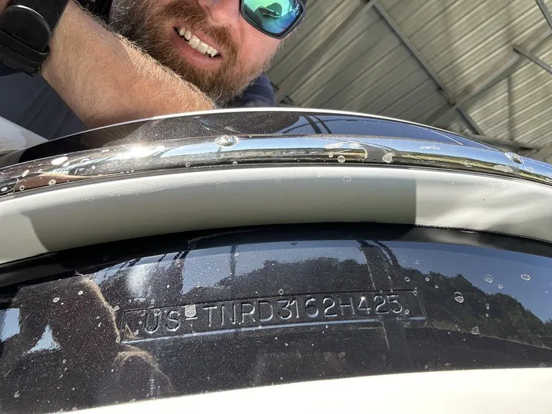 Slide: The Image of 2025 Formula 310 Bowrider boat with visible hull identification number. - 23