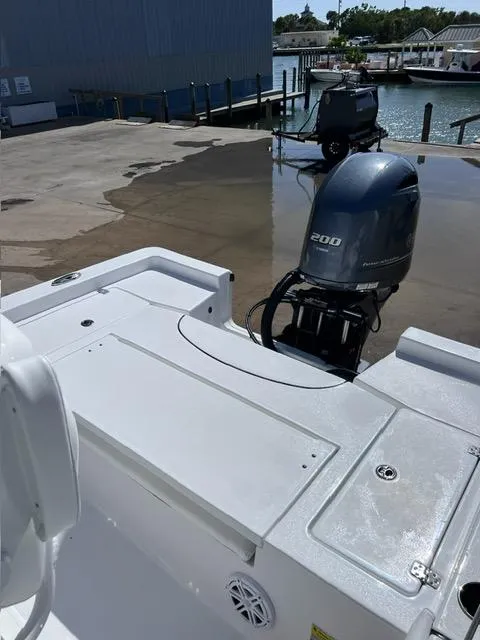 Slide: The Image of 2023 Sportsman Masters 227 Bay Boat with 200 HP engine at dock. - 14