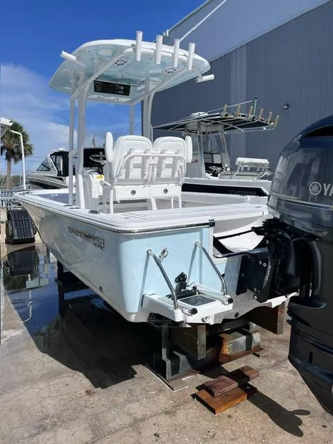 Slide: The Image of 2023 Sportsman Masters 227 Bay Boat with Yamaha engine, docked outdoors. - 4