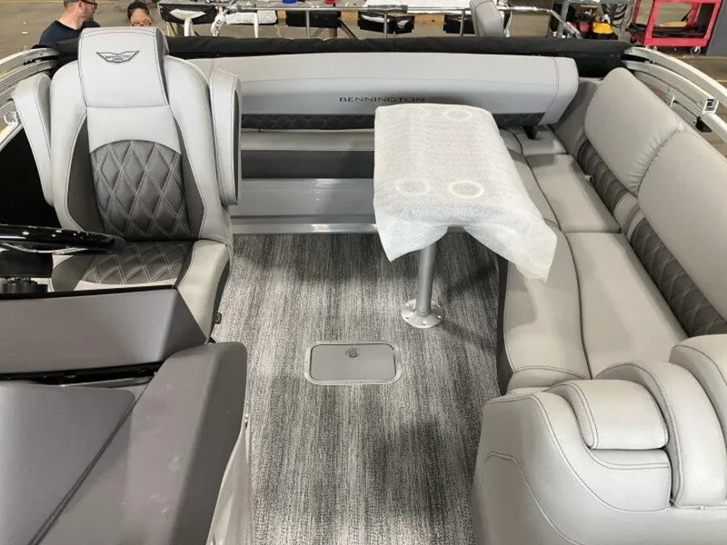 Slide: The Image of 2025 Bennington 23 RSB boat interior with gray seating and table. - 10