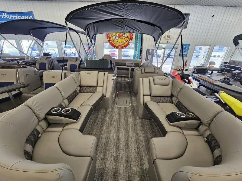 Slide: The Image of Luxurious 2025 Bennington 23 RSB pontoon boat interior with plush seating and canopy. - 15