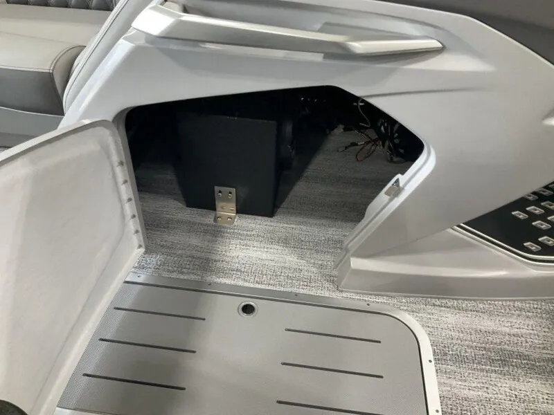 Slide: The Image of Open storage compartment in 2025 Bennington 23 RSB boat interior. - 16