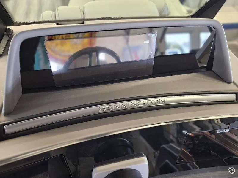 Slide: The Image of 2025 Bennington 23 RSB dashboard with sleek design and modern display. - 28