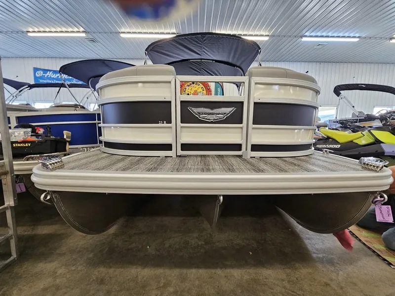 Slide: The Image of 2025 Bennington 23 RSB pontoon boat in showroom, front view. - 9