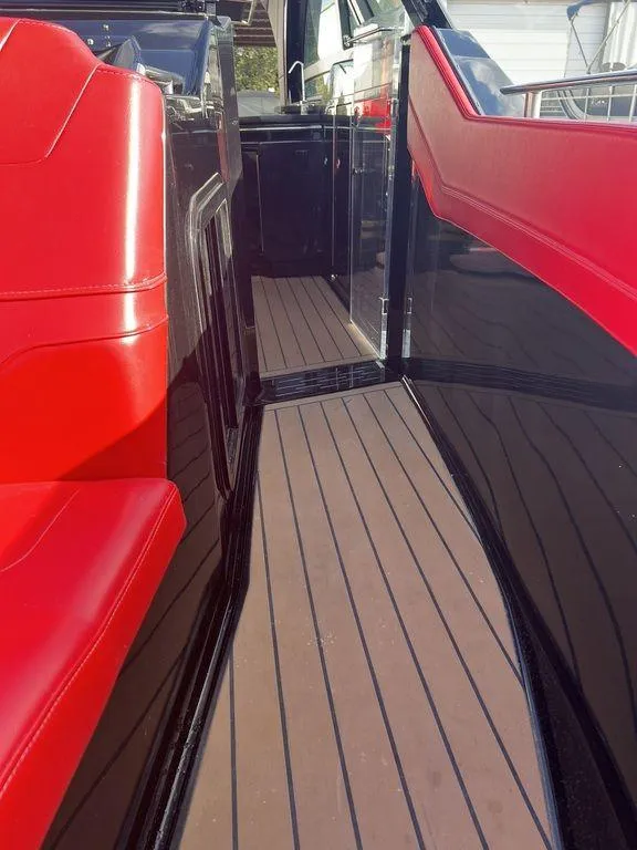 Slide: The Image of 2022 Formula 400 Super Sport Crossover with red seating and sleek deck design. - 29