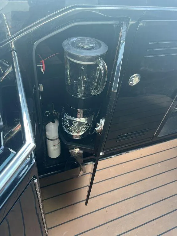 Slide: The Image of 2022 Formula 400 Super Sport Crossover yacht with built-in blender in cabinet. - 31
