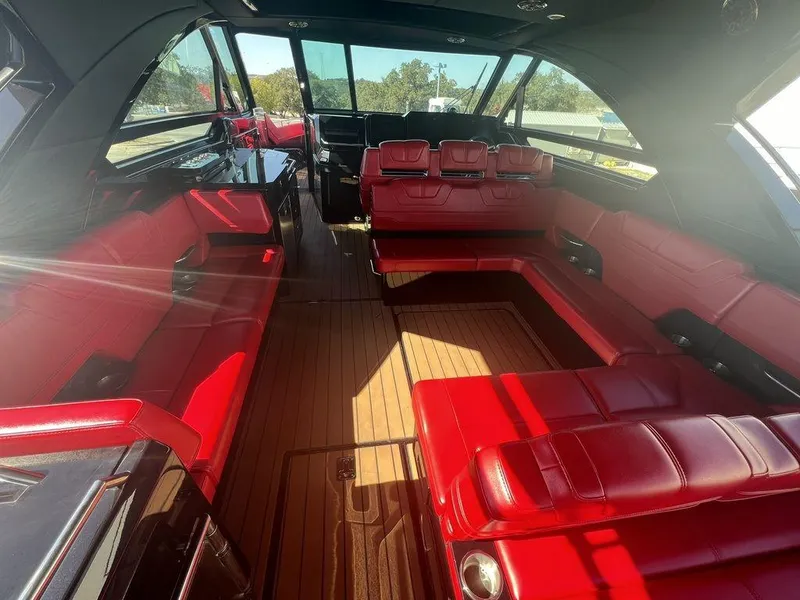Slide: The Image of 2022 Formula 400 Super Sport Crossover interior with red seating and wood flooring. - 32