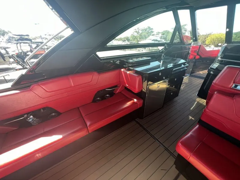 Slide: The Image of Interior of 2022 Formula 400 Super Sport Crossover with red seating and sleek design. - 33