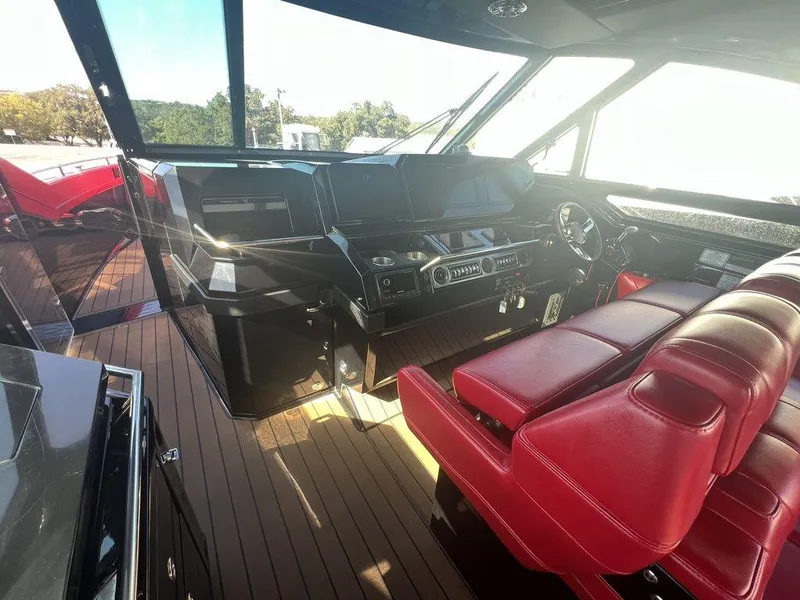 Slide: The Image of Interior of 2022 Formula 400 Super Sport Crossover with red seating and modern dashboard. - 34